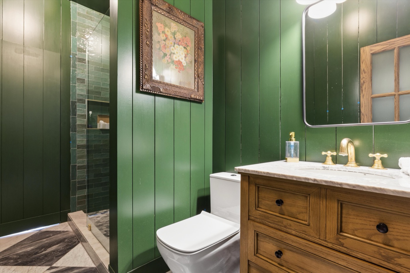 Glynn Gardens third bath — forest green shiplap with brass fixtures