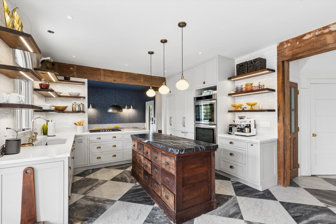 Glynn Gardens kitchen — antique island with marble countertop